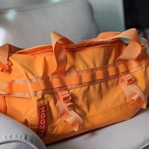 Baboon To the Moon 40L bag (creamsicle. Discontinued color)